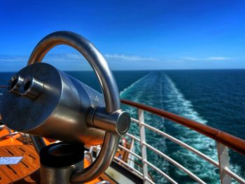 Close-up of sea against clear blue sky