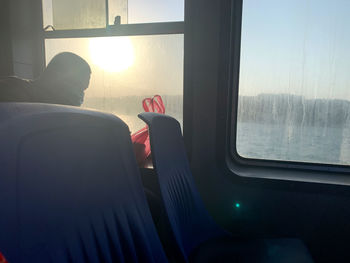 Man seen through train window