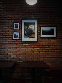 Low angle view of window on brick wall