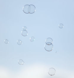 Close-up of bubbles against blue background