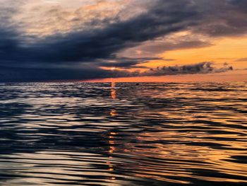 Scenic view of sea against dramatic sky