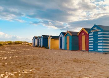 Beach huts against sky