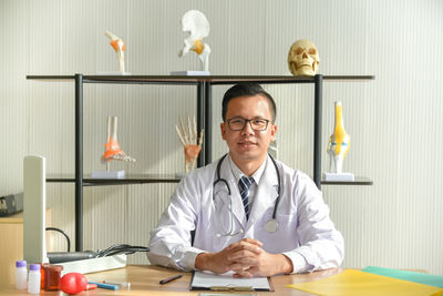 Portrait of man wearing mask on table