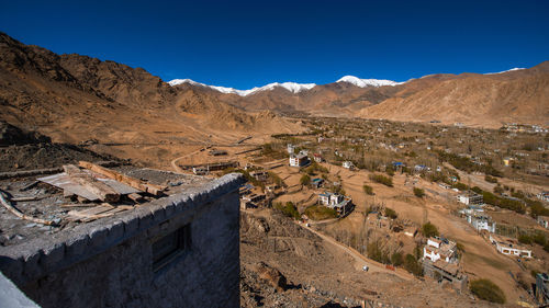 Scenic view of mountains against clear blue sky