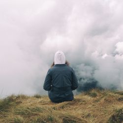 Rear view of man standing on field