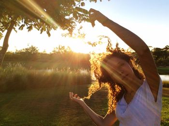 Built structure on countryside landscape against bright sun