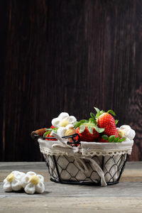 Close-up of fruits in basket on table