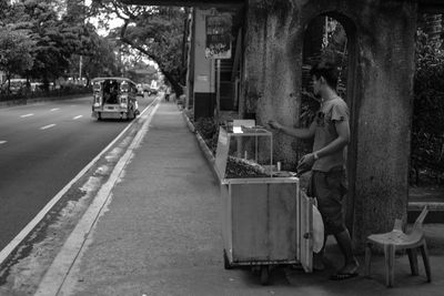 Rear view of woman on street in city