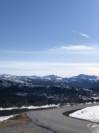 Scenic view of snow covered mountains against sky