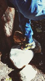 Low section of man standing outdoors