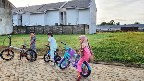 People riding bicycle on building