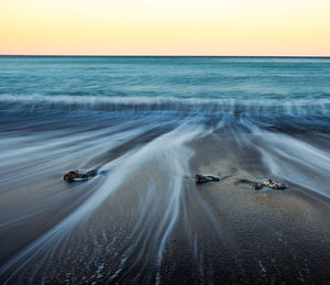 Scenic view of sea against clear sky