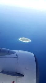 Aerial view of airplane flying in sky