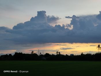 Scenic view of field against sky during sunset