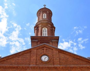 Low angle view of built structure against blue sky