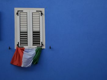 Closed blue window of building