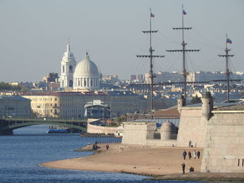 View of buildings in city against clear sky