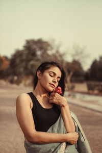 Portrait of young woman looking away