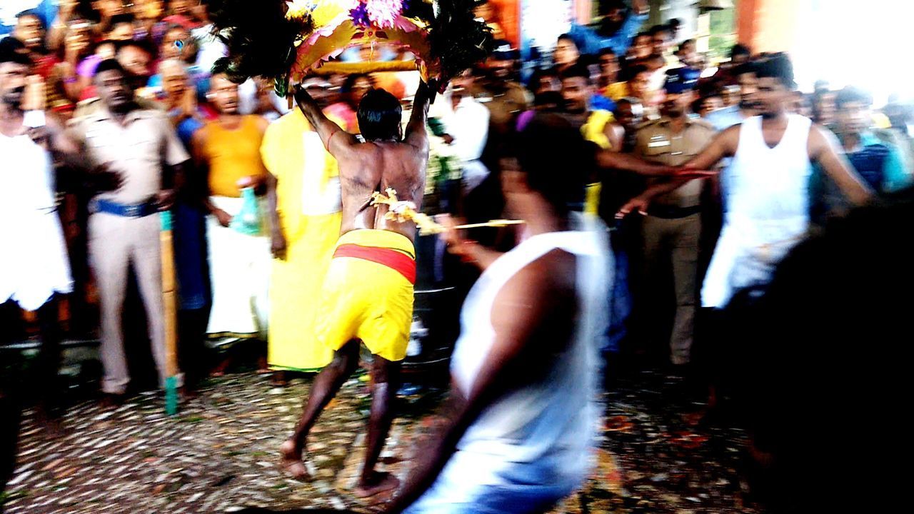 CROWD OF PEOPLE IN TRADITIONAL CLOTHING