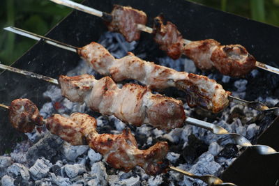 High angle view of meat on barbecue grill