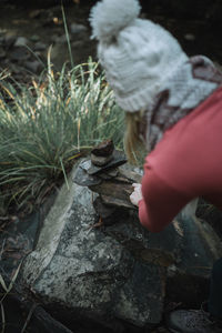 Close-up of man holding leaf