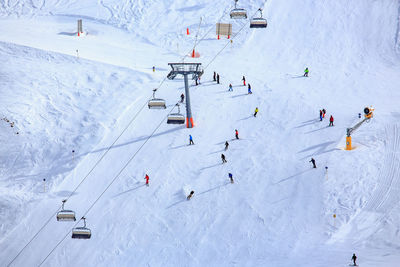 High angle view of people on snowcapped mountain