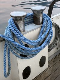 Close-up of rope tied to bollard