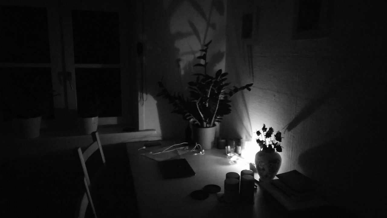 candlelight. · Hamburg germany Candle Candles Household apartment kitchentable work environment Workplace light and shadow Light Darkness Night Shot Night Photography black and white monochrome