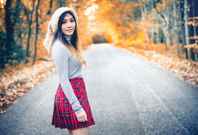 Portrait of beautiful woman in forest during autumn