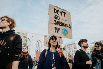 FRIENDS STANDING AGAINST PEOPLE AT THE ROAD