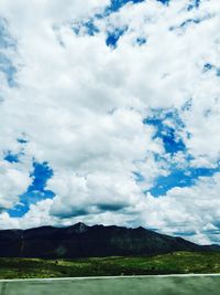 Scenic view of landscape against cloudy sky