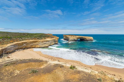 View of beach against cloudy sky