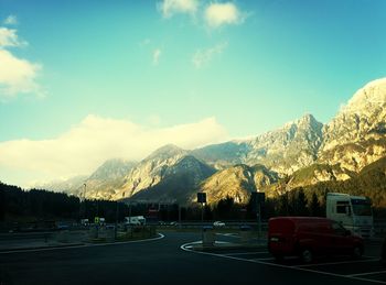 Scenic view of mountains against cloudy sky