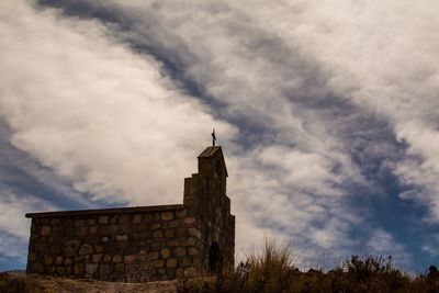 Low angle view of historic church against sky