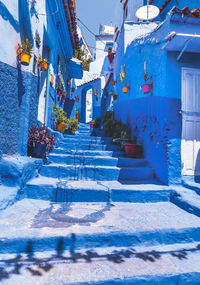 Staircase amidst houses in city