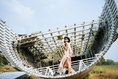 Woman standing on structure