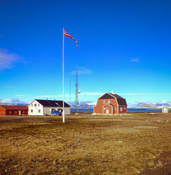 Built structure on beach against blue sky