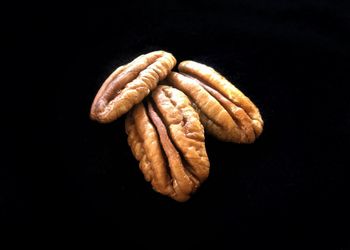 Close-up of bread against black background