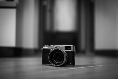 Close-up of camera on table