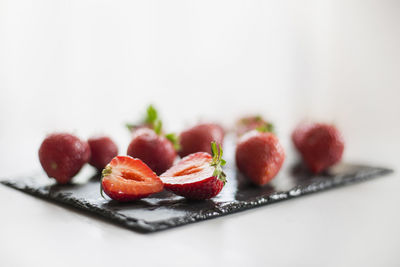 Close-up of fruits in plate on table