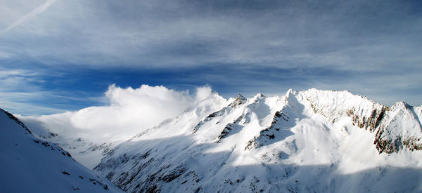 Scenic view of snow mountains against sky