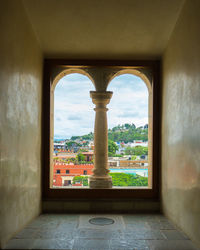 Buildings seen through window