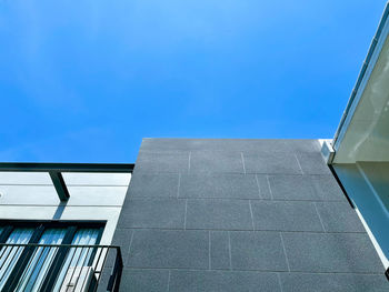 Low angle view of building against clear blue sky