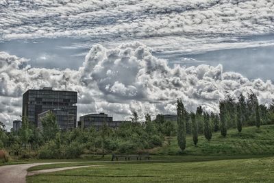 Panoramic view of trees and buildings against sky