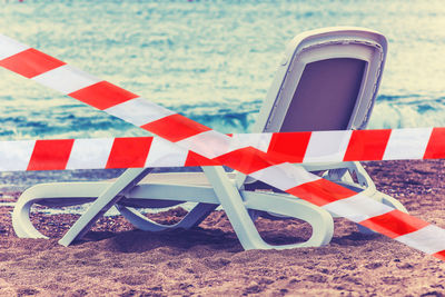 Close-up of flags on beach