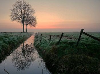 Scenic view of landscape against sky during sunset