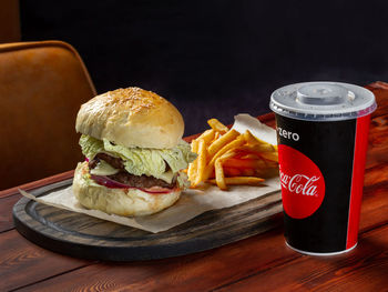 View of burger and vegetables on table