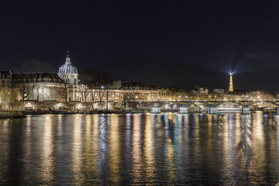 Illuminated buildings in city at night