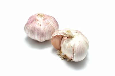 Close-up of garlic on white background