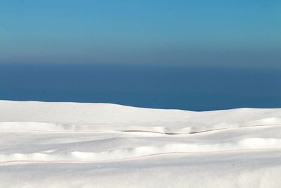 Scenic view of sea against sky during winter